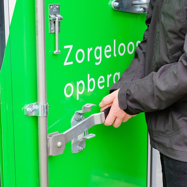 Detail of the door lock of a Medium Box as the driver is closing it